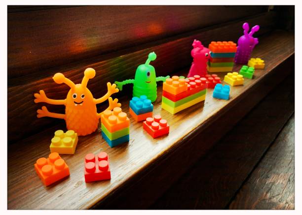 istock Colorful Plastic Toys on Window Sill 1202099866