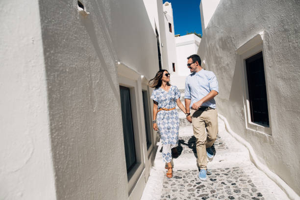 istock Happy couple walking and laughing together 1202100180