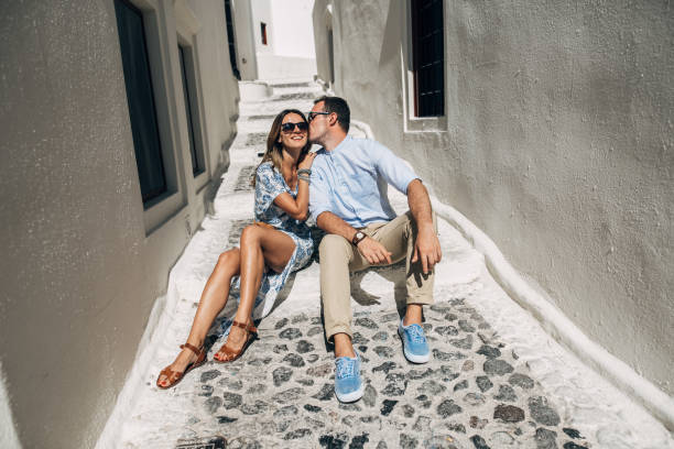 istock Happy couple hugging and laughing together 1202100891