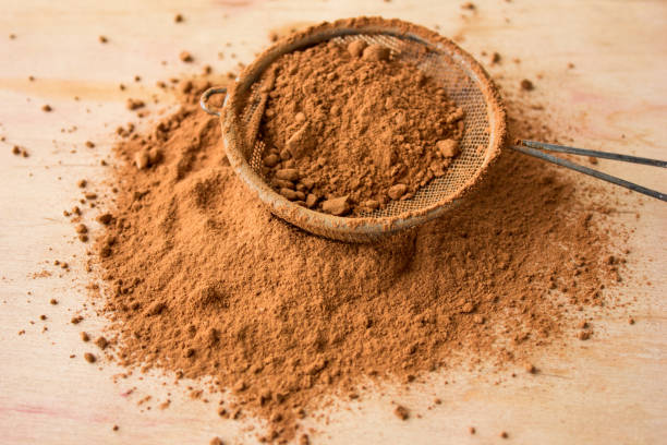 istock Raw cacao or cocoa  powder on a wooden table 1202100912