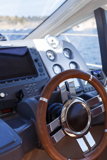 istock Steering wheel and control panel on a luxury yacht 1202101237