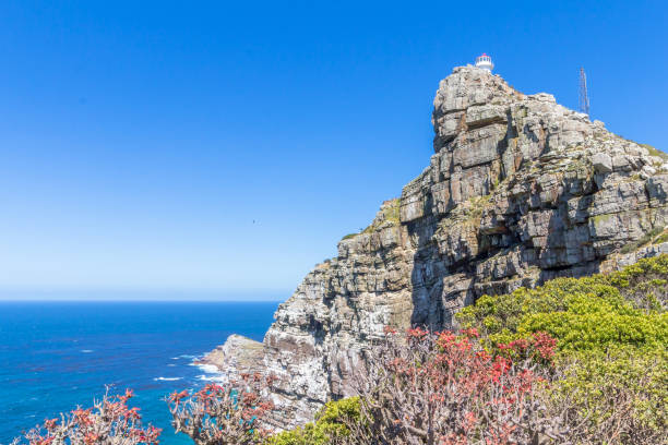 istock Cape Point with the old lighthouse built in 1850 high up on the cliff overlooking the Atlantic ocean near Cape Town 1202102142