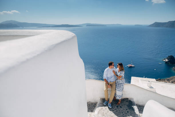istock Couple in sunglasses hugging with seaview 1202102532