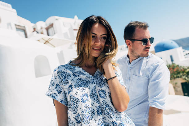 istock Couple in sunglasses hugging with seaview 1202103751