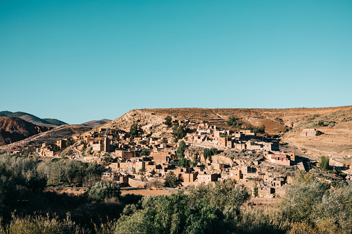 The Berber village of Asni comprised of clay houses built on a hillside in the foothills of the Atlas Mountains