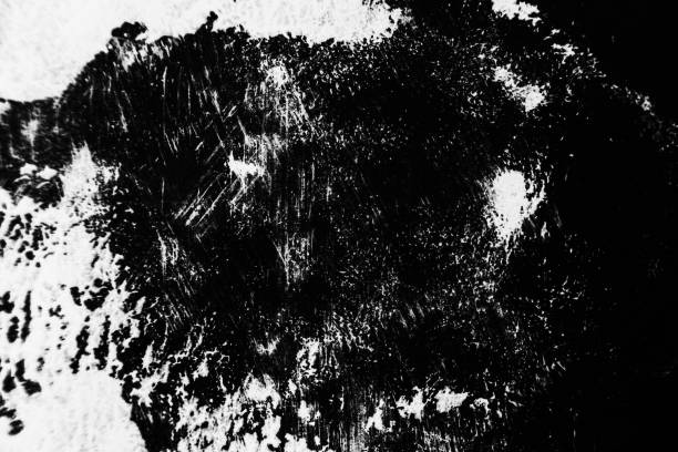 istock Patterns of white paint from a brush on a black background 1202105265