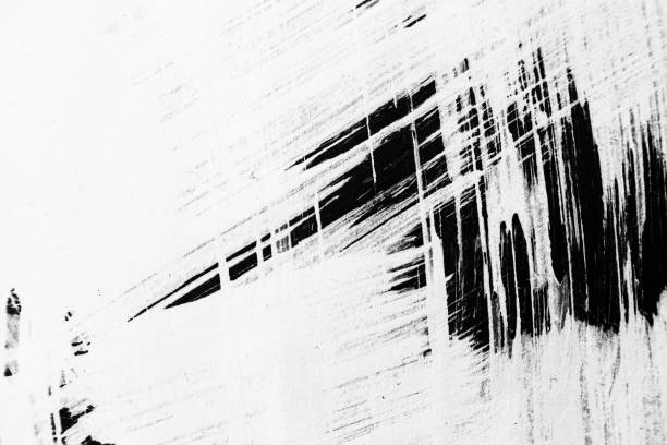 istock Patterns of white paint from a brush on a black background 1202106327
