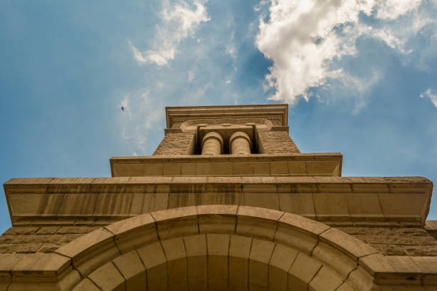 stone tower of Saint George Coptic Orthodox Church with blue cloudy sky