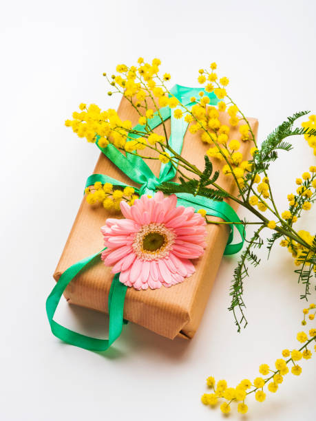 istock Womans day. Gift box with mimosa flowers 1202111297