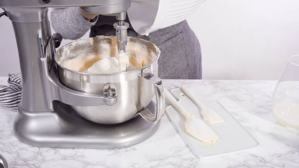 istock Mixing ingredients in standing kitchen mixer to bake funfetti cake. 1202115036