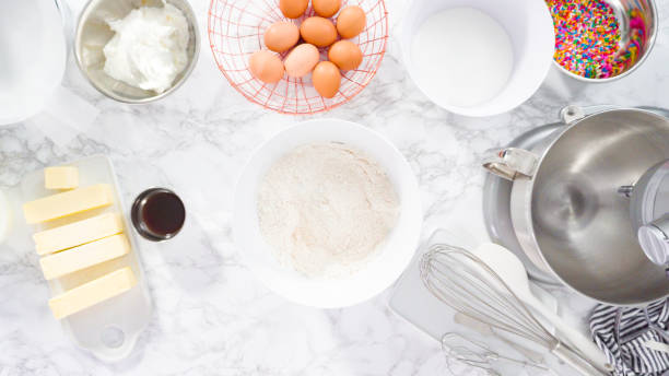 istock Mixing ingredients in standing kitchen mixer to make funfetti cake. 1202115454