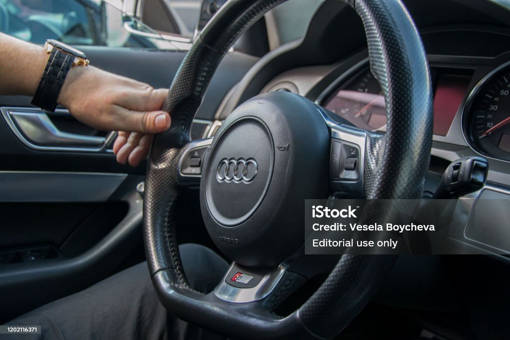 Man driving Audi, transportation concept, hands holding steering wheel white driving on the road Smolqn, Bulgaria - march 22, 2019 - Man hands holds steering wheel, driving concept, car on the road, audi, transportation concept Audi Stock Photo