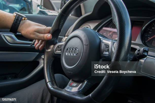 Man Driving Audi Transportation Concept Hands Holding Steering Wheel White Driving On The Road Stock Photo - Download Image Now