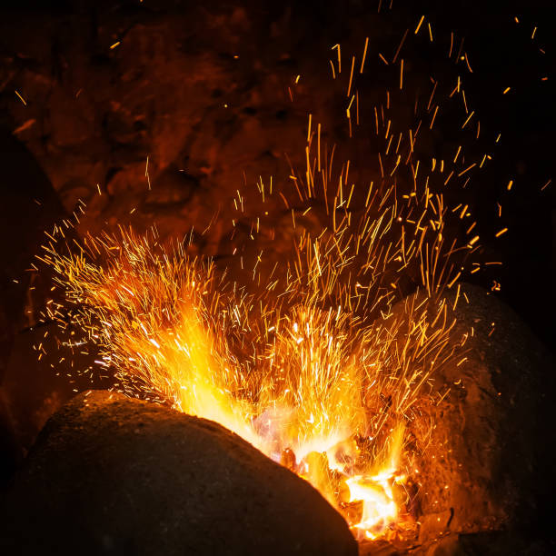 istock Sparks of a fire on a black background 1202117563