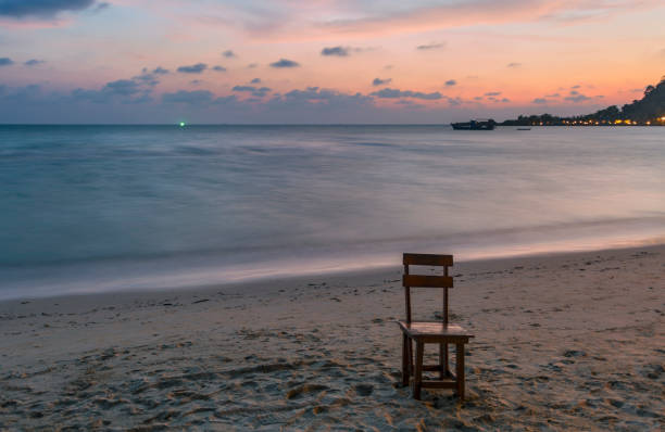 istock chairs on a tropical beach at sunset 1202117758