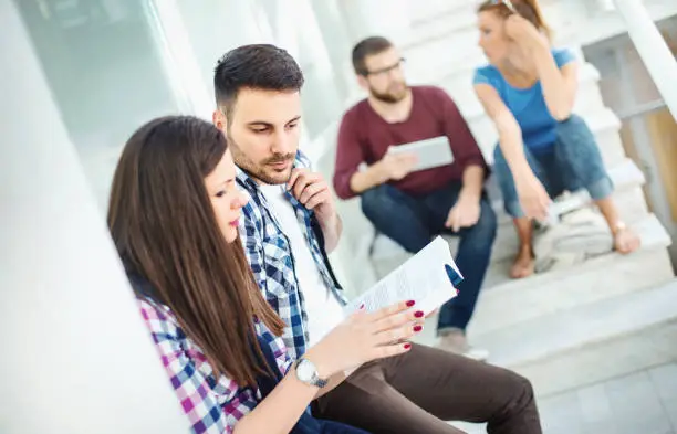 Photo of Students in a hallway between classes.