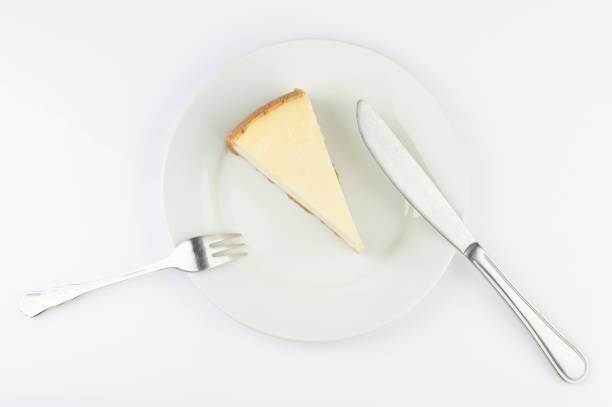 istock Cheesecake on plate above top view 1202120953