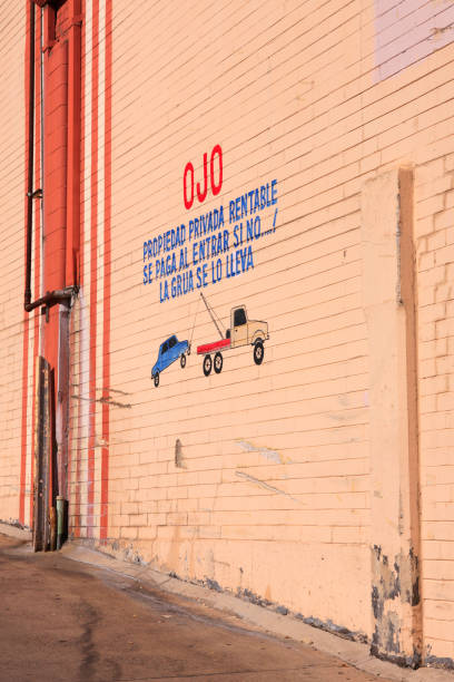 Simple artwork for OJO towing company on the wall of his business in the US-Mexican border city of Nogales, AZ Simple artwork for OJO towing company on the wall of his business in the US-Mexican border city of Nogales, AZ nogales arizona stock pictures, royalty-free photos & images