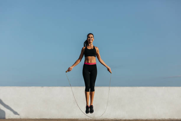 istock Young woman training with a jumping rope 1202124790