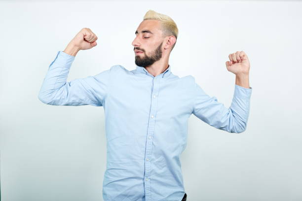 istock man with blond hair, black beard over isolated white background shows emotions 1202124840