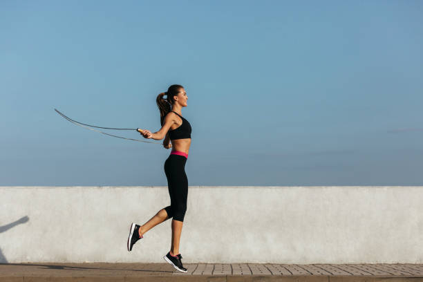 istock Young woman training with a jumping rope 1202124882