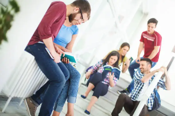 Photo of Students in a hallway between classes.