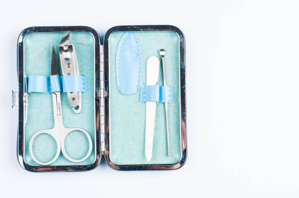 istock Set of tools for manicure in blue box isolated on white background. Copy space 1202125197