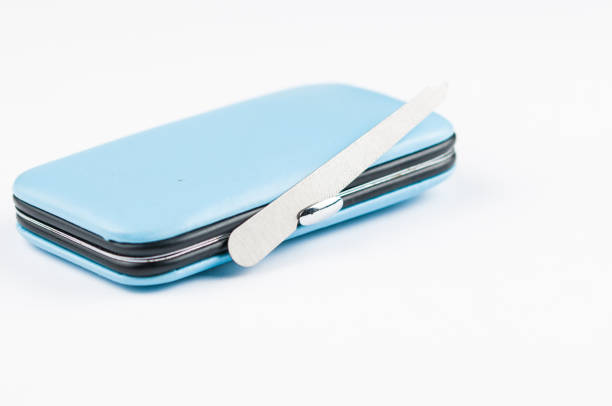 istock Set of tools for manicure in blue box isolated on white background. Copy space 1202125258