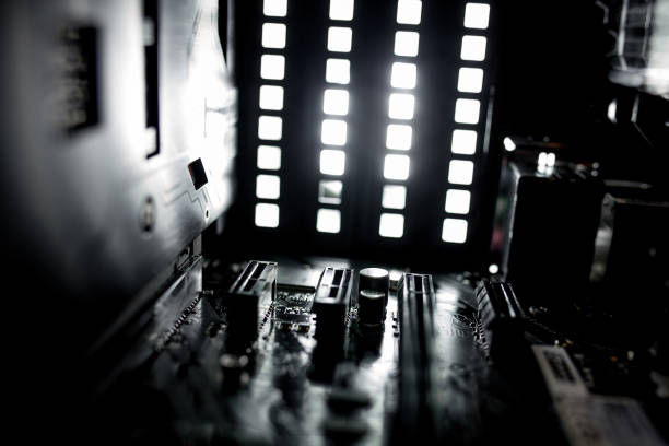 istock Kyiv, Ukraine - August 17, 2019: Inside of the personal computer power supply motherboard, cables, discs, fan. PC service. 1202125315