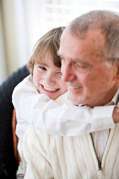 istock Grandfather getting hug from grandson 120212633
