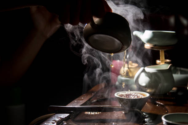 istock Incredible Asian tea brewing ritual. Asia, green tea, steam, table, tradition 1202126736