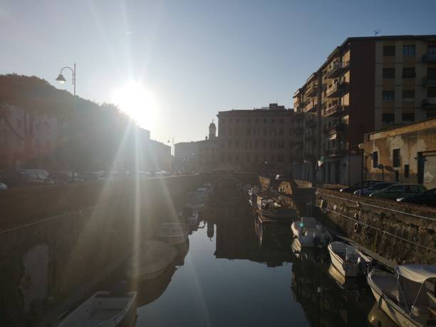 istock Sun on city canal 1202127180