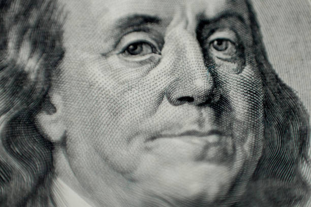 istock Portrait of Benjamin Franklin macro from one hundred dollars bill 1202127900
