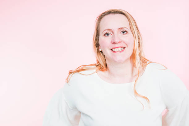 istock Studio portrait of smiling middle aged woman. 1202129432