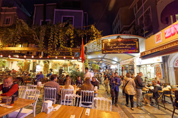 Small street with many restaurant, bar and many people in Eminönü area. stock photo