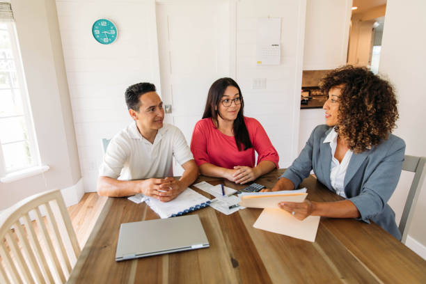 istock Married Couple Meeting with Financial Advisor 1202131509