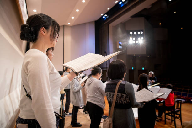 istock Women singing at concert 1202132419