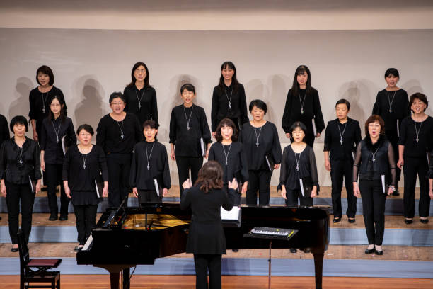 istock Women singing at chorus concert 1202132432