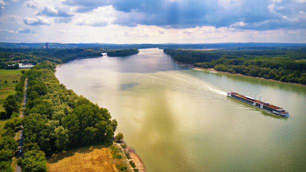 istock Tourist ship on Danube river. Sunny and rainy mixed weather. 1202132493