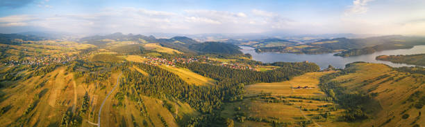 Panorama aerial View of Czorsztyn Lake and Beskids hills Panorama aerial View of Czorsztyn Lake and Beskids hills, reservoir on Dunajec river in Tatras mountains, lesser Poland beskid mountains photos stock pictures, royalty-free photos & images