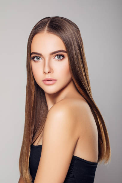 istock Young woman with beautiful brown hairstyle 1202136093