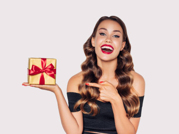 istock Beautiful woman with present 1202137755