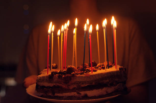 istock candles on a piece of cake 1202138572