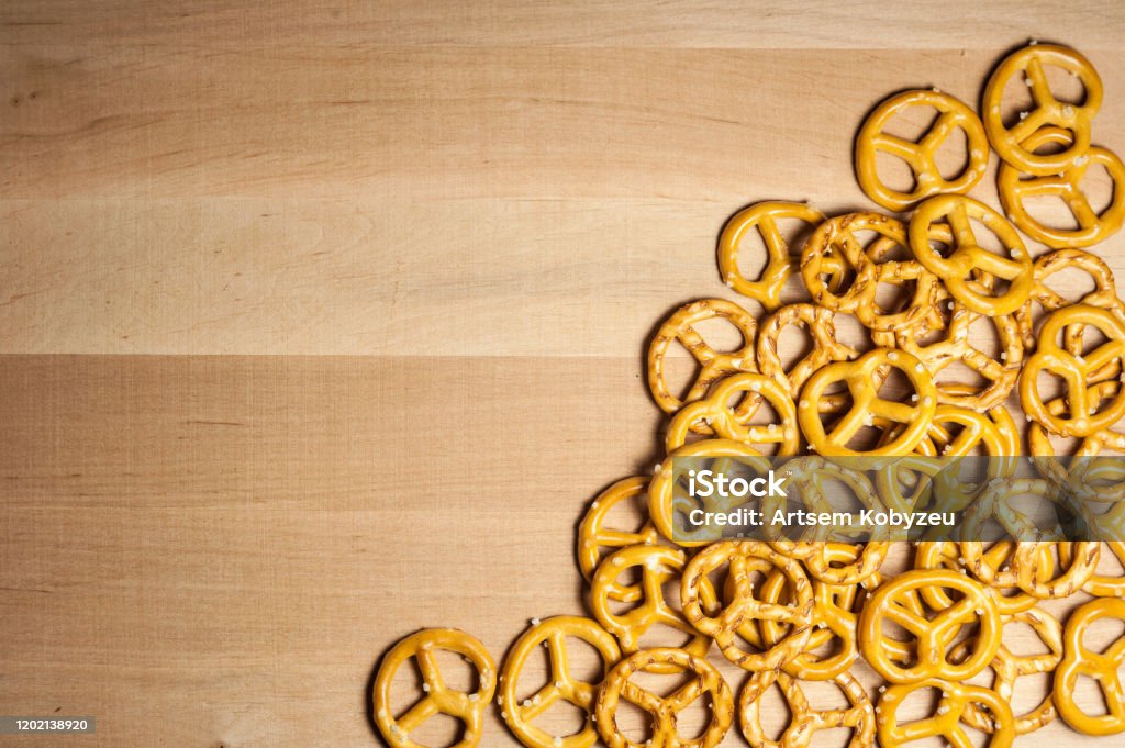 pretzels with coarse pretzels with coarse salt on a wooden board Above Stock Photo