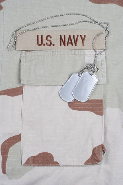 istock US NAVY branch tape with dog tags on desert camouflage uniform 1202140906