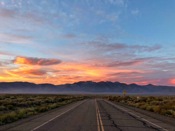 istock Majestic Pink Sunset over a Road 1202141092