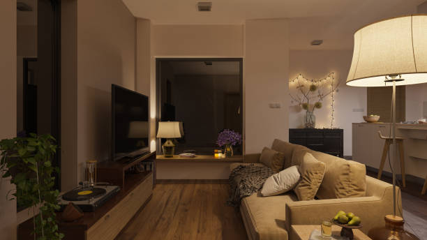 sanft beleuchtetes open plan wohnzimmer bei nacht - floor lamp lamp lamp shade contemporary stock-fotos und bilder