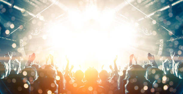 istock Concert hall with people silhouettes 1202142375