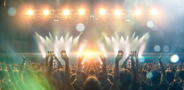 istock Concert hall with people silhouettes 1202142443
