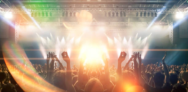 istock Concert hall with people silhouettes 1202142445